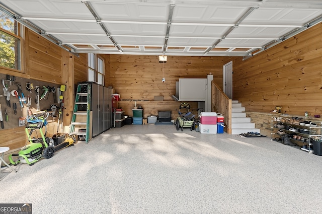 garage featuring wooden walls