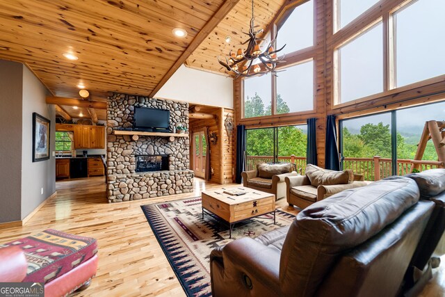 26 Clarice Ln, Sautee Nacoochee, GA 30571 - living room with a chandelier, wooden ceiling, a high ceiling, light wood-style floors, and a fireplace