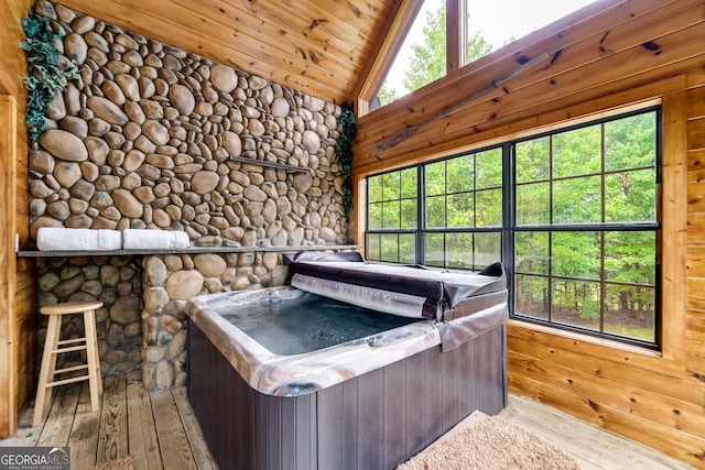 26 Clarice Ln, Sautee Nacoochee, GA 30571 - bedroom featuring lofted ceiling, hardwood / wood-style flooring, wood ceiling, and wooden walls