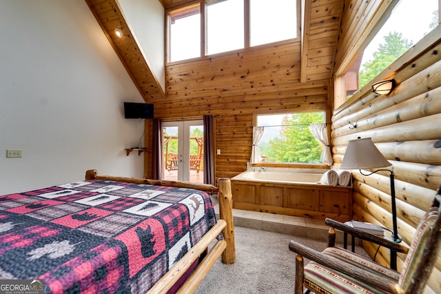 carpeted bedroom featuring access to outside, multiple windows, high vaulted ceiling, and log walls