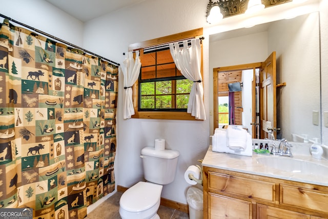 bathroom featuring a shower with shower curtain, tile patterned flooring, vanity, and toilet