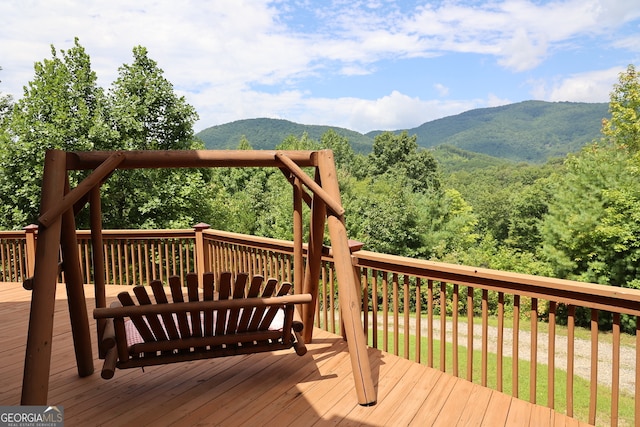 wooden terrace with a mountain view