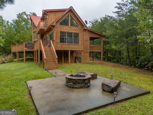 26 Clarice Ln, Sautee Nacoochee, GA 30571 - rear view of property featuring a patio, an outdoor fire pit, stairway, and a lawn