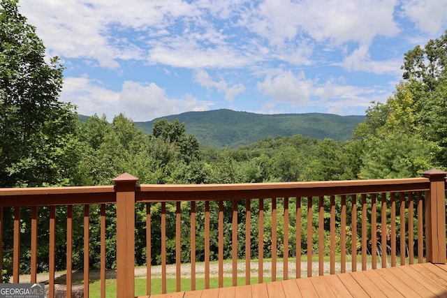 wooden terrace with a mountain view