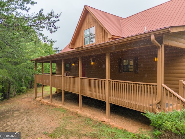 view of side of property featuring a deck