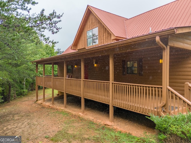 26 Clarice Ln, Sautee Nacoochee, GA 30571 - rear view of property featuring a deck, metal roof, and board and batten siding
