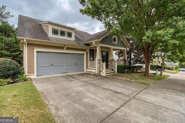 view of front facade featuring a garage and covered porch