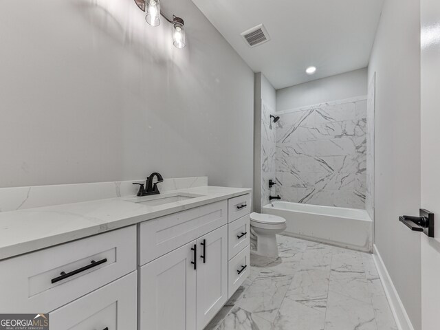 full bathroom with vanity, toilet, and tiled shower / bath combo