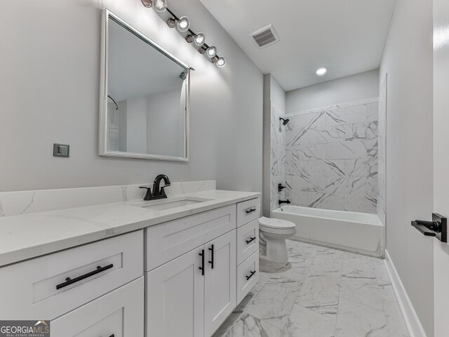 full bathroom featuring toilet, tiled shower / bath combo, and vanity