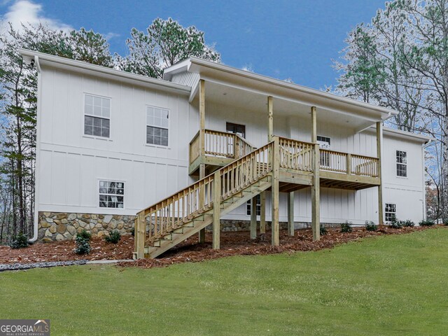 rear view of house with a lawn