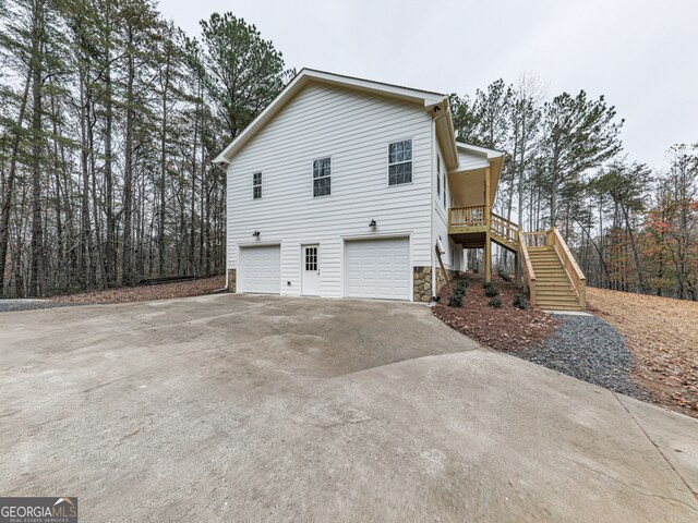 view of side of property featuring a garage