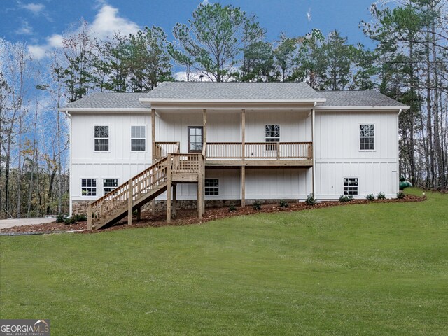 rear view of house with a yard