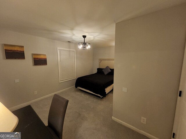 carpeted bedroom with visible vents and baseboards