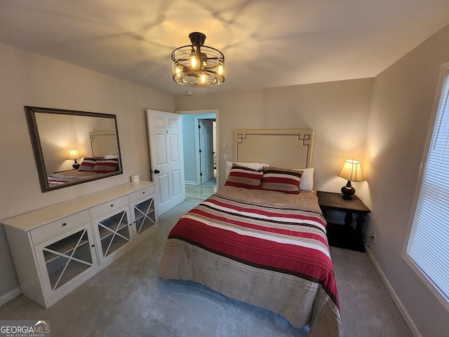 bedroom featuring carpet floors and baseboards