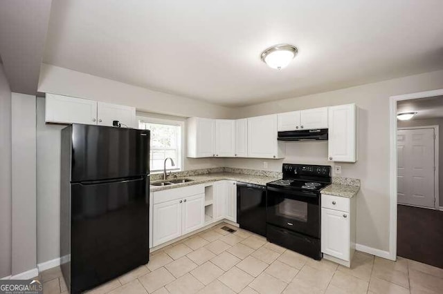 kitchen with white cabinets, light stone countertops, sink, and black appliances