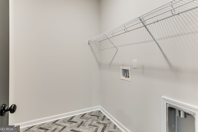 washroom featuring washer hookup and parquet floors