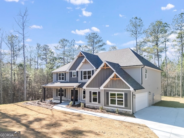 craftsman inspired home with covered porch and a garage