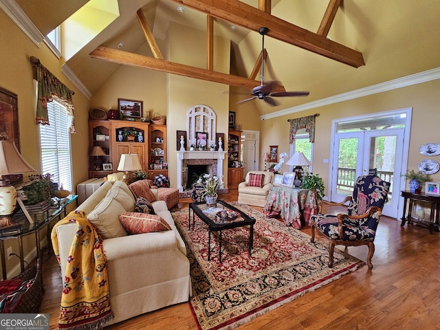 living room featuring high vaulted ceiling, a wealth of natural light, and ceiling fan