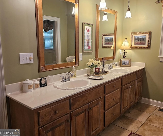 bathroom featuring tile patterned flooring and vanity