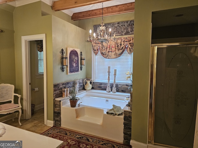 bathroom with tile patterned flooring, beamed ceiling, a chandelier, and separate shower and tub