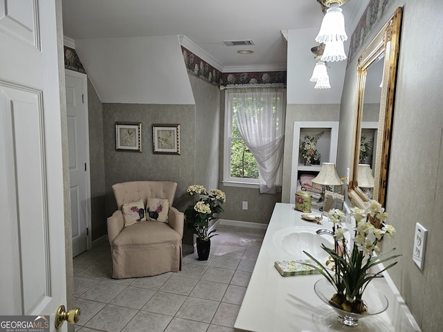 bathroom featuring vanity, ornamental molding, and tile patterned floors