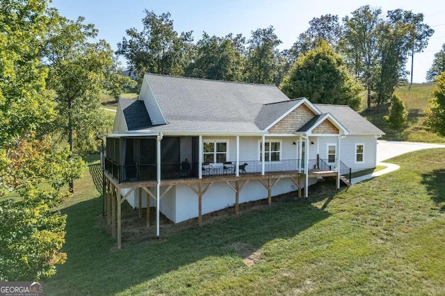 wooden terrace with a patio and a yard