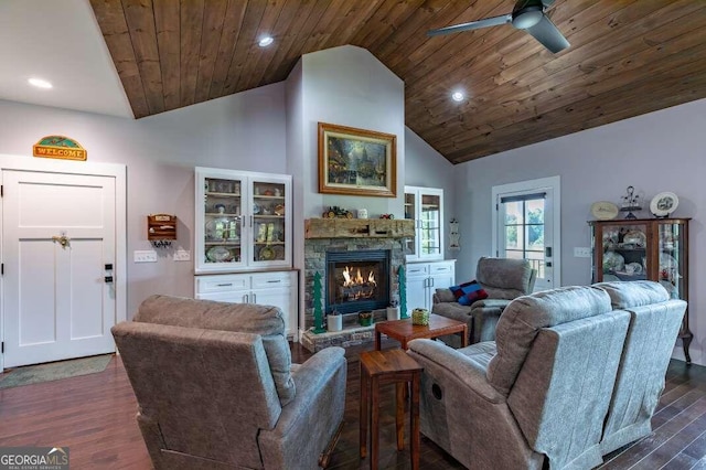 living room with wooden ceiling, ceiling fan with notable chandelier, dark wood-type flooring, and high vaulted ceiling