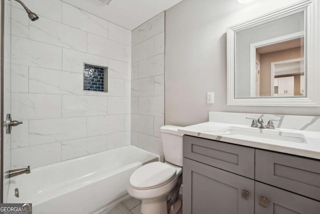 full bathroom with vanity, toilet, and tiled shower / bath