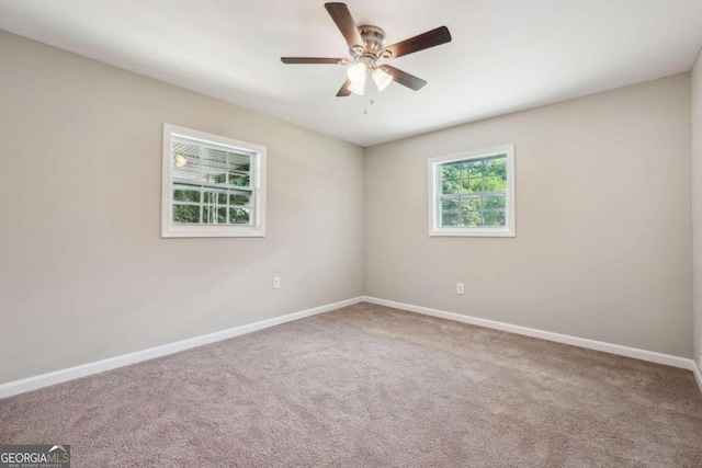 unfurnished room with carpet and ceiling fan