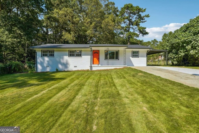 single story home with a front lawn and a carport