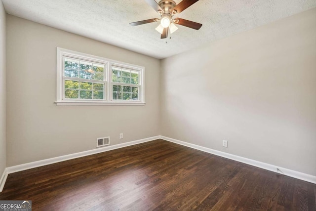 unfurnished room featuring ceiling fan, a textured ceiling, and dark hardwood / wood-style flooring