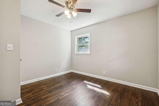 spare room featuring a textured ceiling, dark hardwood / wood-style flooring, and ceiling fan