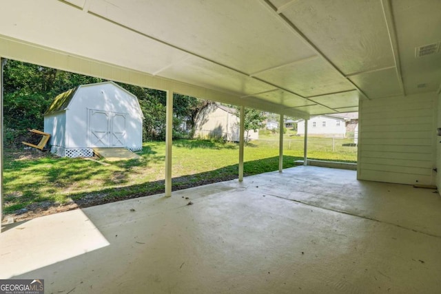 view of patio / terrace featuring a storage shed