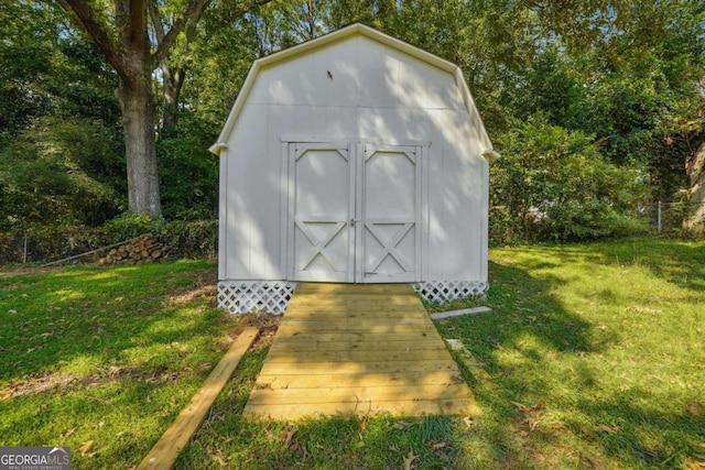 view of outdoor structure featuring a yard