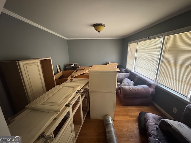 interior space with ornamental molding and light hardwood / wood-style flooring