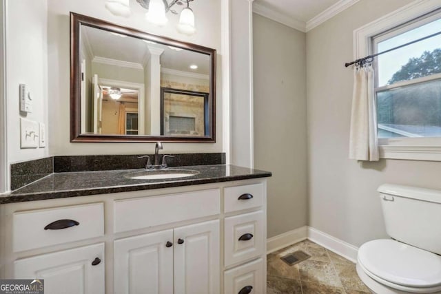 bathroom featuring ceiling fan, crown molding, vanity, and toilet