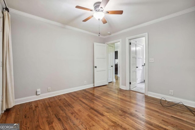 unfurnished bedroom with ceiling fan, crown molding, and hardwood / wood-style floors