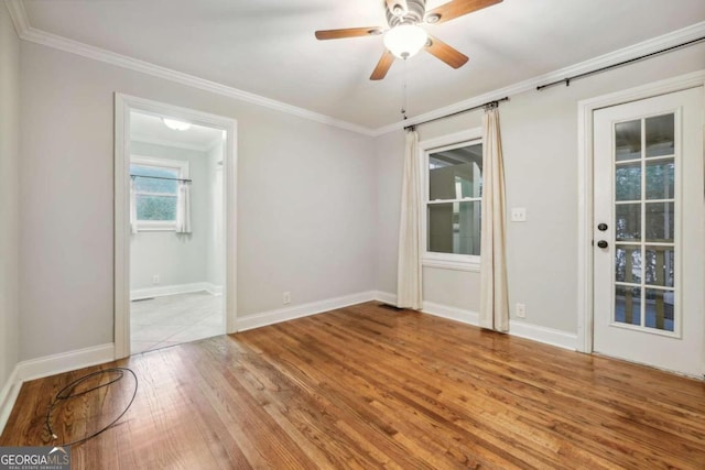 unfurnished room featuring ceiling fan, crown molding, and light hardwood / wood-style floors