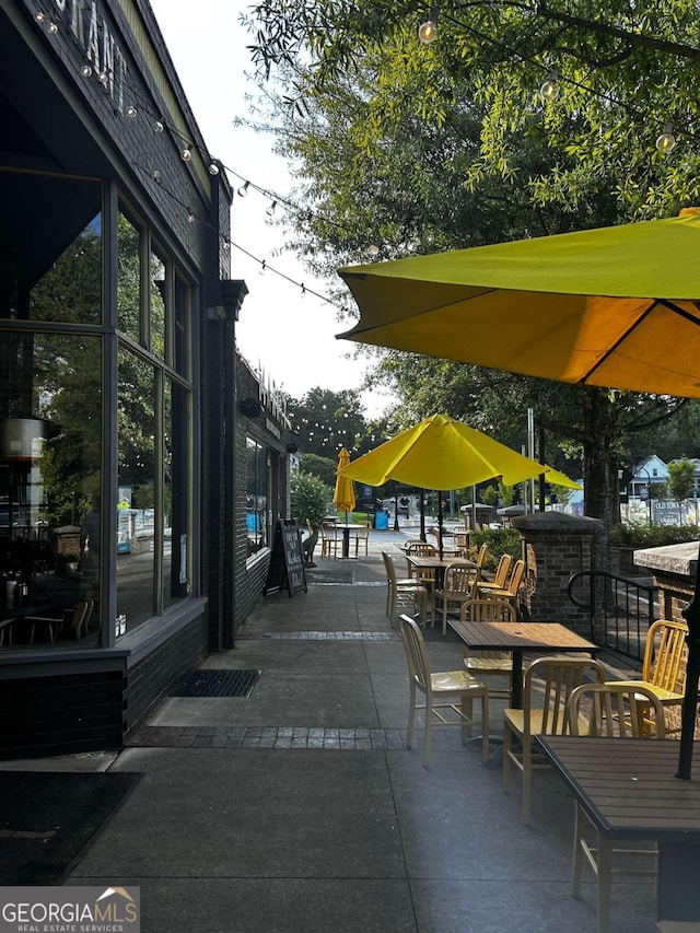 view of property's community featuring a patio area