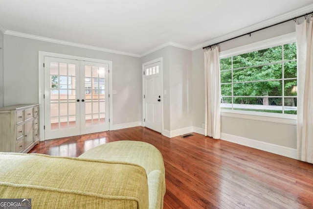 interior space featuring french doors, hardwood / wood-style floors, and a healthy amount of sunlight