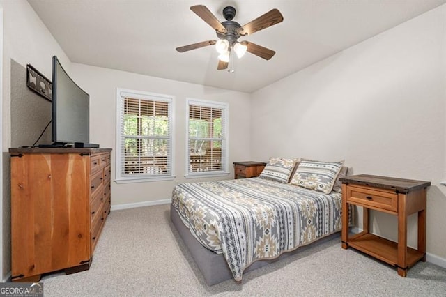 bedroom featuring ceiling fan and light colored carpet