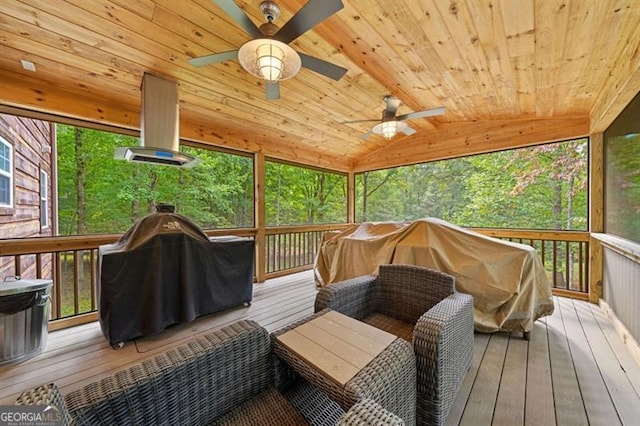 wooden deck with ceiling fan and a grill