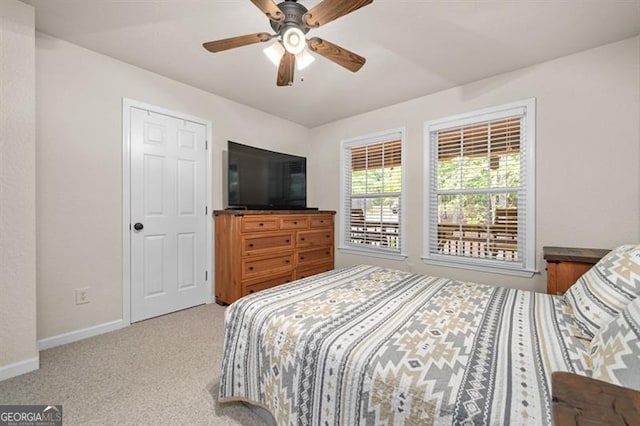 bedroom featuring ceiling fan and carpet floors