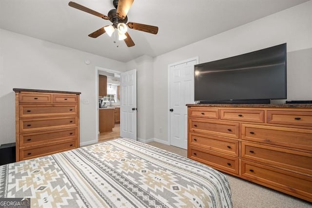 bedroom featuring light carpet and ceiling fan