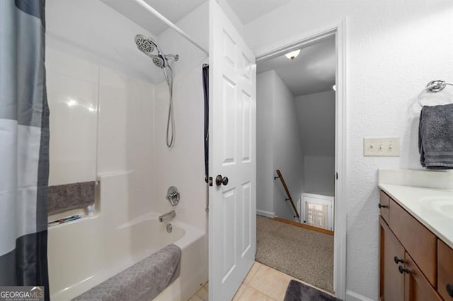 bathroom featuring vanity, shower / tub combo, and tile patterned flooring