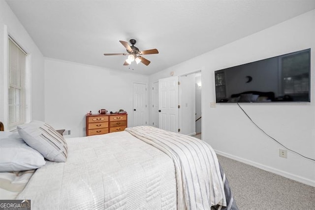 bedroom with ceiling fan and carpet floors