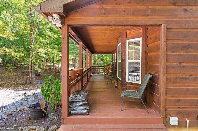 wooden terrace featuring a porch