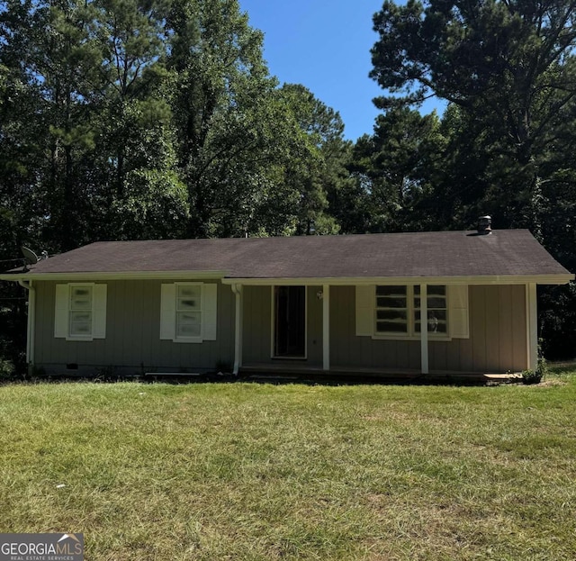 ranch-style home with a front yard