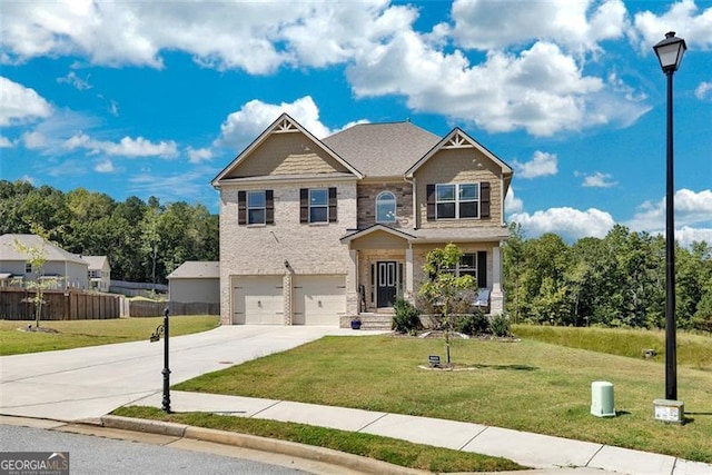 craftsman house with a garage and a front lawn