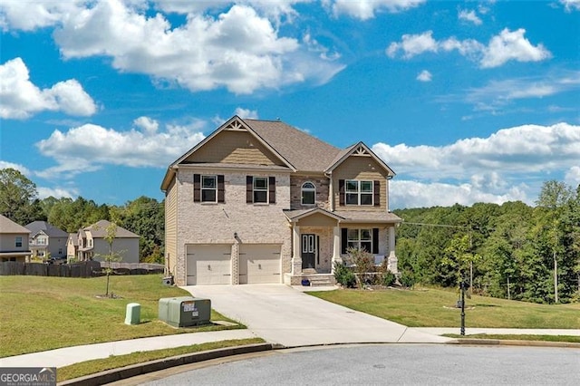 craftsman house featuring a front yard and a garage